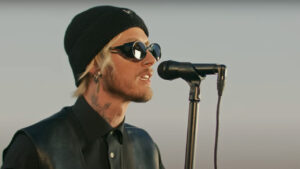 mgk Releases Luke 'Dingo' Trembath Tribute 'your name forever' Featuring Oli Sykes, Avenged Sevenfold &amp; Mod Sun