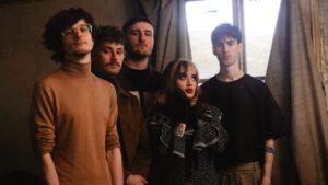 INTERVIEW: Love Rarely On Turning Inherited Pain Into Forward Motion On Debut Album 'Pain Travels'